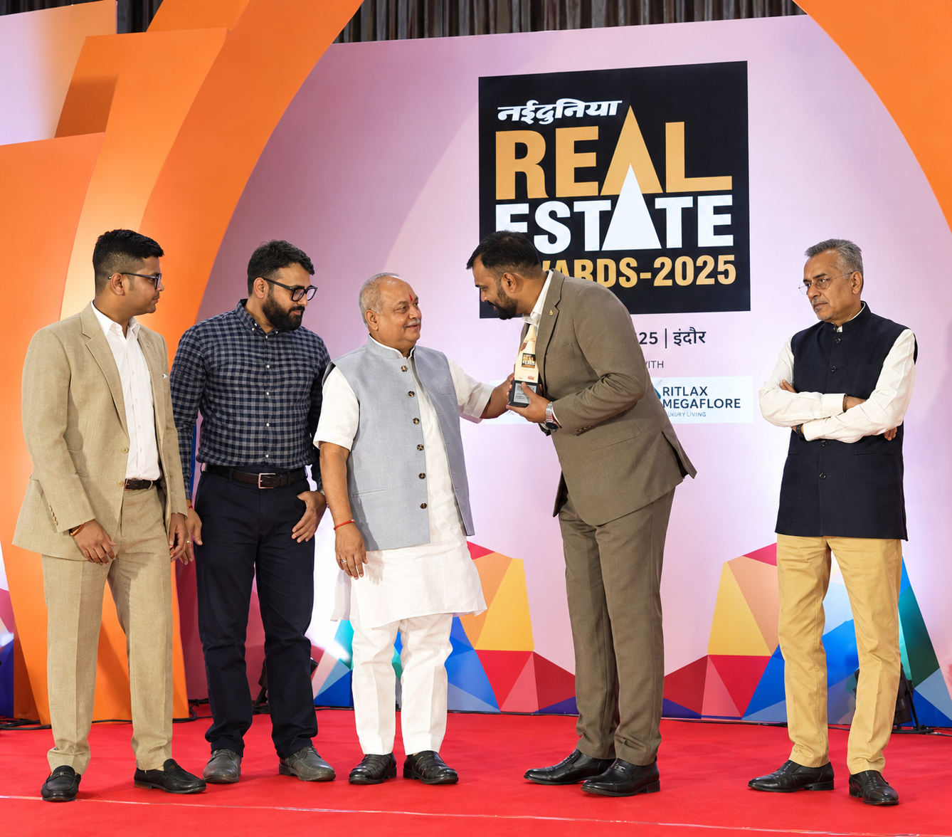 HM Realty team on stage at the Real Estate Awards 2025, Indore