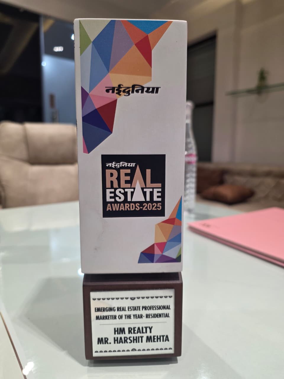 Real Estate Awards 2025 trophy — Emerging Real Estate Professional, Marketer of the Year (Residential), HM Realty